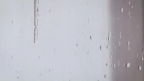 A freezing drop runs down the window. Closeup Stock Footage 117843258