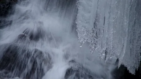 Freezing flowing stream in winter, close up Stock Footage 45588528