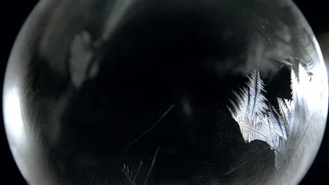 Freezing ice bubble ball Stock Footage 92086035