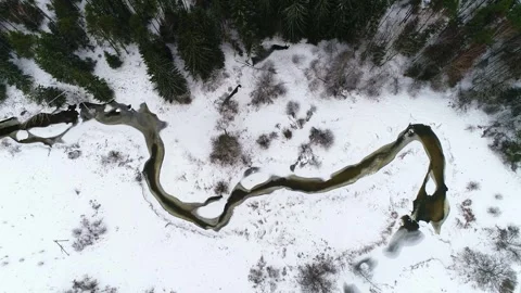 Freezing narrow river from above Stock Footage 265586939