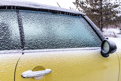 Freezing rain on a car window. Stock Photos