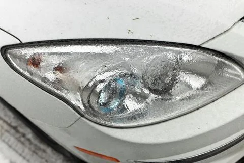 Freezing Rain Creates a Layer of Ice and Coats a Passenger Vehicle. Close up of Stock Photos