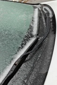 Freezing Rain Creates a Layer of Ice and Coats a Passenger Vehicle. Close up of Stock Photos