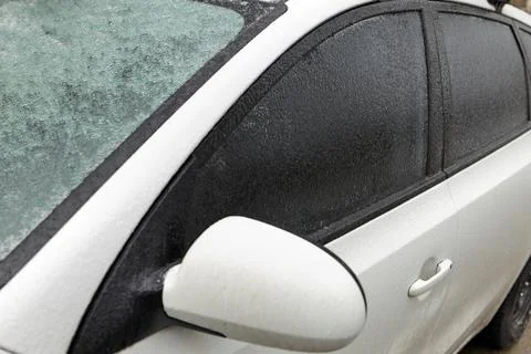 Freezing Rain Creates a Layer of Ice and Coats a Passenger Vehicle. Close up of Stock Photos