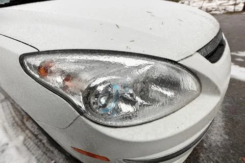 Freezing Rain Creates a Layer of Ice and Coats a Passenger Vehicle. Close up of Stock Photos