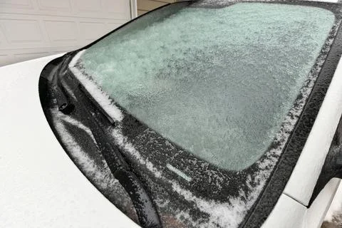 Freezing Rain Creates a Layer of Ice and Coats a Passenger Vehicle. Close up of Stock Photos