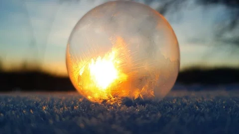 Freezing soap bubble against the background of the sun 4k Stock Footage 255951975