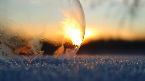 Freezing soap bubble against the background of the sun 4k Stock Footage 255952365