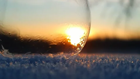 Freezing soap bubble against the background of the sun 4k Stock Footage 255953038