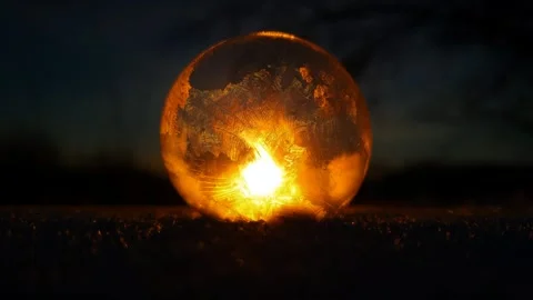 Freezing soap bubble against the background of the sun 4k Stock Footage 255954776