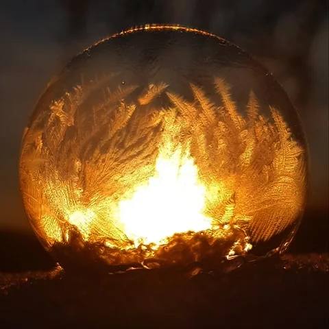 Freezing soap bubble against the background of the sun 4k Stock Footage 255955862