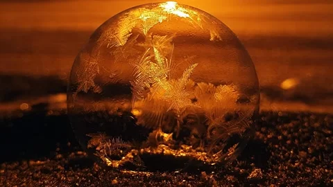 Freezing soap bubble against the background of the sun 4k Stock Footage 255956929