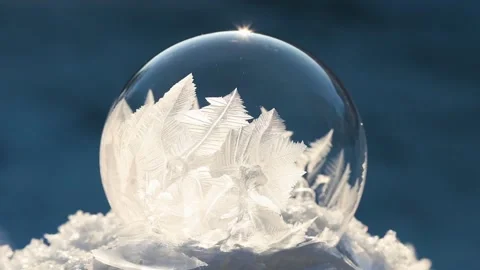 Freezing soap bubble forming ice crystals Stock Footage 329374311
