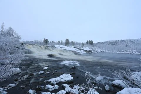 Freezing winter waterfall Stock Photos