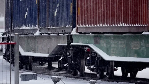 Freght train in Snowstorm long focus shot Stock Footage 70790816