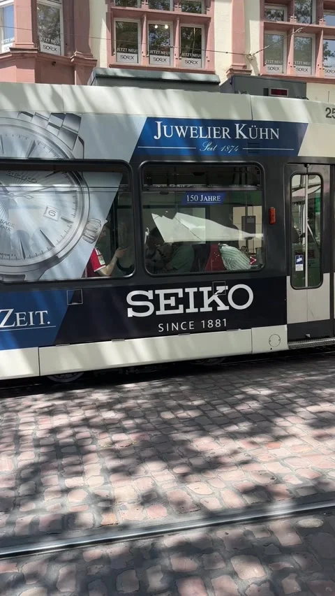 Freiburg tram moving through city streets in Germany Stock Footage 337433748