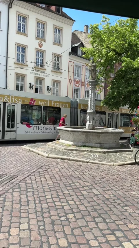 Freiburg tram moving through city streets in Germany Stock Footage 337433762