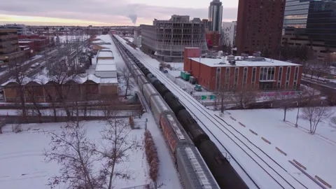 Freight Cargo Train and Winter Railway Corridor Aerial View in Calgary Stock-Footage 347410332