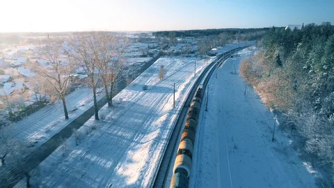 Freight Cargo Train Going Through Winter Snowy Forest, Aerial View Video stock 105349062