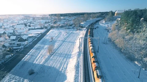 Freight Cargo Train Going Through Winter Snowy Forest, Aerial View Video stock 105349072