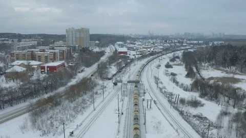 Freight Cargo Train Going through winter forest in the suburbs , a bird's-eye Stock Footage 126362197