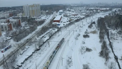 Freight Cargo Train Going through winter forest in the suburbs , a bird's-eye Video stock 126382211