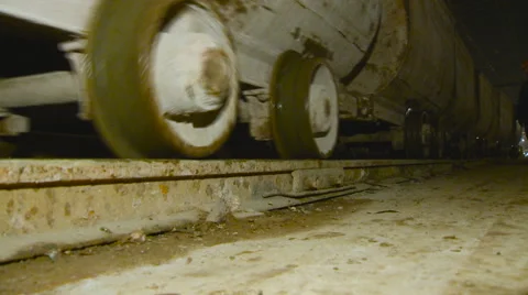 Freight Carriages go by Rail. Closeup. Underground Construction of Subway Stock Footage 62631677