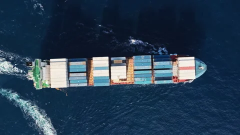 Freight container loaded on cargo vessel. Aerial cargo ship passing harbor Stock Footage 346568066