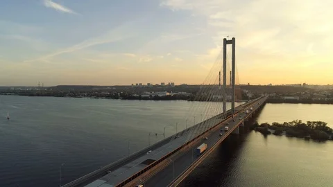 Freight container semi trucks transporting goods over the bridge at dusk. Stock Footage 90764584