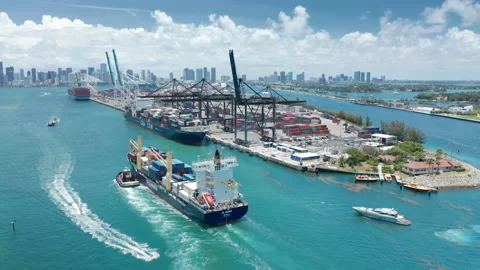 Freight containers loaded on cargo vessel in Atlantic ocean bay, Miami downtown Stock-Footage 149993755