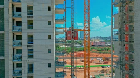 Freight elevator at the construction site of high rides up and down. A freight Stock Footage 206050832