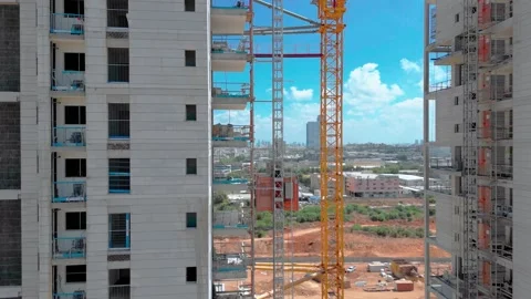 Freight elevator at the construction site of high rides up and down. A freight Stock Footage 208942597