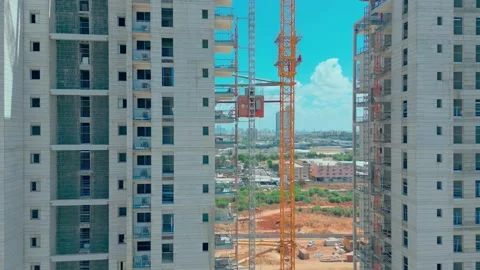 Freight elevator at the construction site of high rides up and down. A freight Stock Footage 212981977