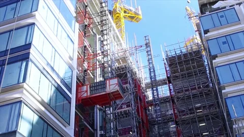 Freight elevator lifts the building material of the new skyscraper Video stock 159653681