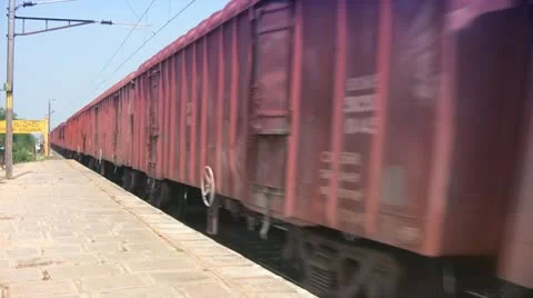 Freight Goods train passes through station in India Stock Footage 21253393