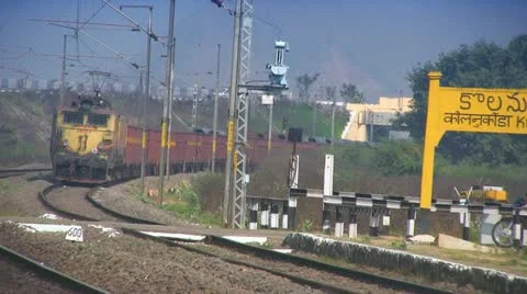 Freight Goods train passes through station in India Stock Footage 21257980