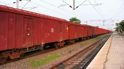 Freight Goods train passes through station in India Stock Footage 21642656