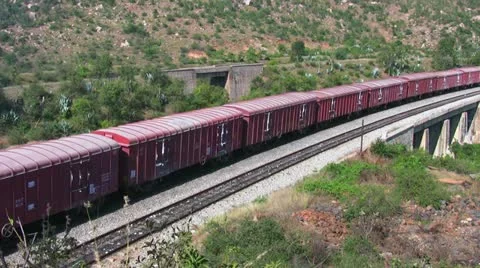 A Freight goods train is passing by a rural station in India. Stock Footage 20536206