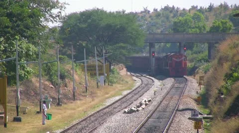 A Freight goods train is passing by a rural station in India. Stock Footage 20536598