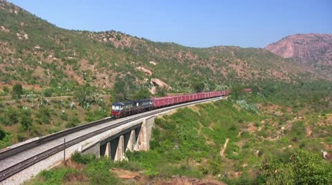 A Freight goods train is passing by a rural station in India. Stock Footage 20536620