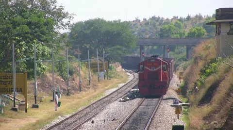 A Freight goods train is passing by a rural station in India. Stock Footage 20536932