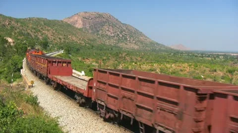 A Freight goods train is passing by a rural station in India. Stock Footage 20537075