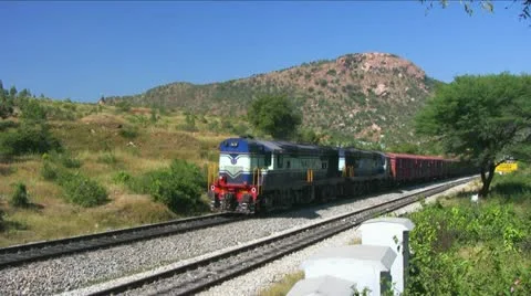   A freight goods train starts at Makalidurga station near Bangalore India. Stock Footage 20830022