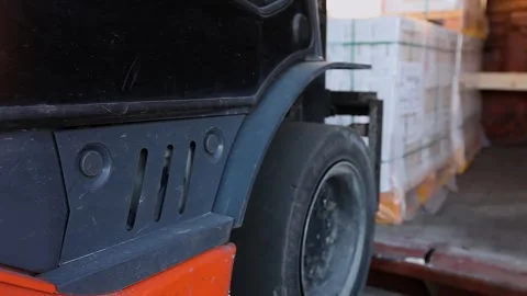 A freight handler loads a railcar with boxed products. Loading finished products Video stock 333582324