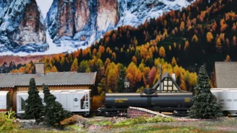 Freight model train in miniature. Model railway. Mountains ambientation Stock Footage 232425720
