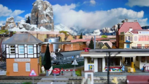 Freight model train passing through a city. Stock Footage 260806659