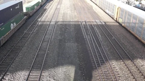 Freight rail cars run on a parallel track Stock Footage 70563595