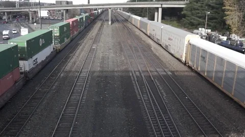 Freight rail cars run on a parallel track Video stock 70563943