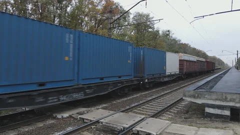 Freight rail transport passes by the camera Stock Footage 142941078