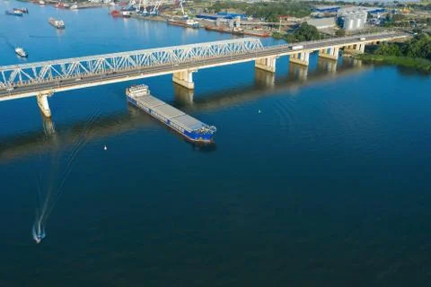 A freight ship has just passed the bridge. Stock Photos
